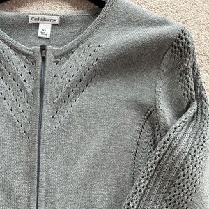 Grey zippered cardigan with beautiful detail on neck, sides and sleeves.